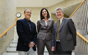 Kessler, Petersilia, and McConnell posed on stairway of Robert Crown Law Building.