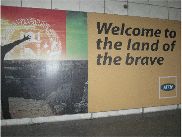 Photo of sign reading "Welcome the land of the brave" in Kabul International Airport
