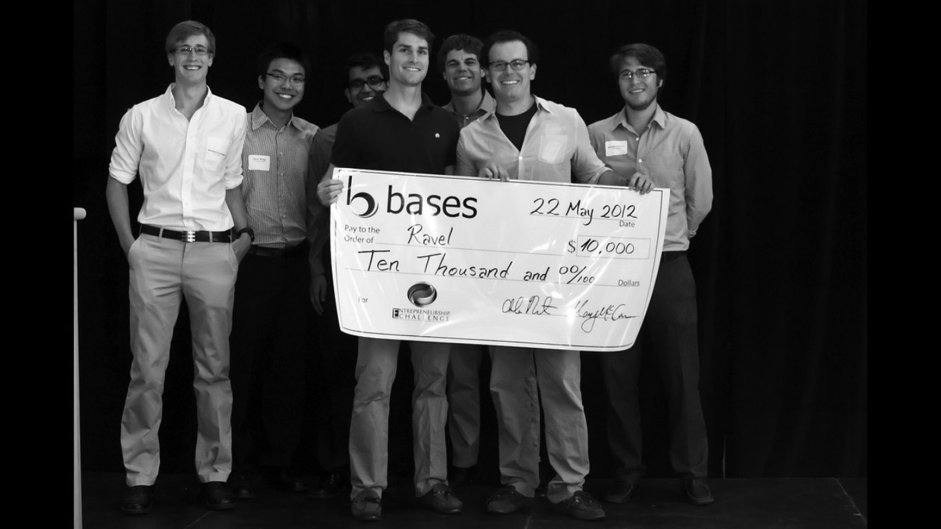 Lewis, Reed and BASES Team Members posing with giant check.