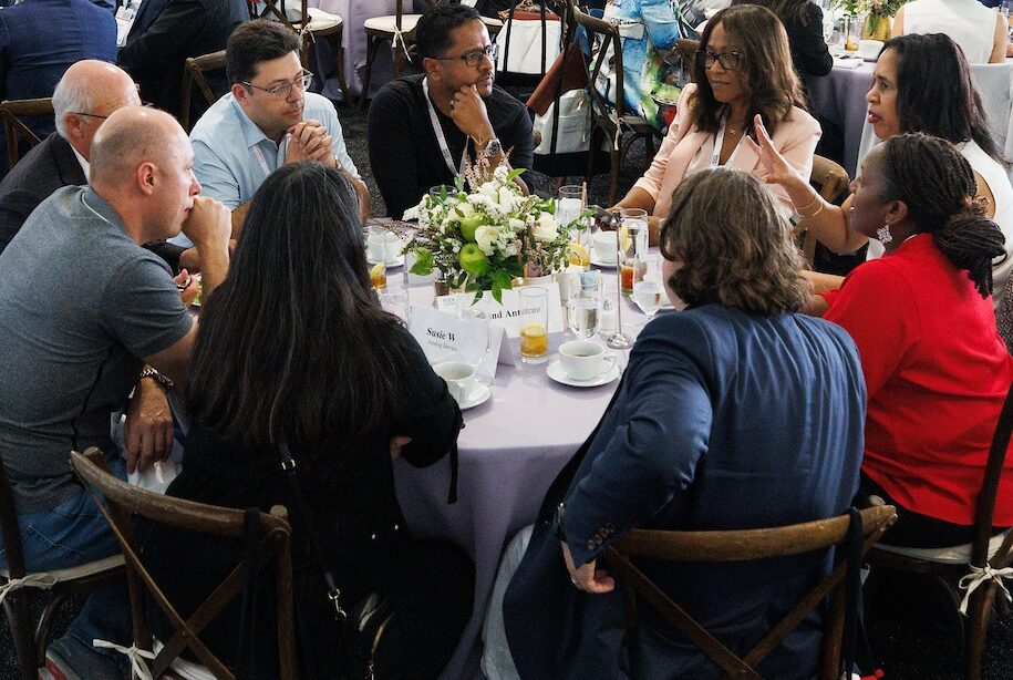 photo of executives sitting at a round table