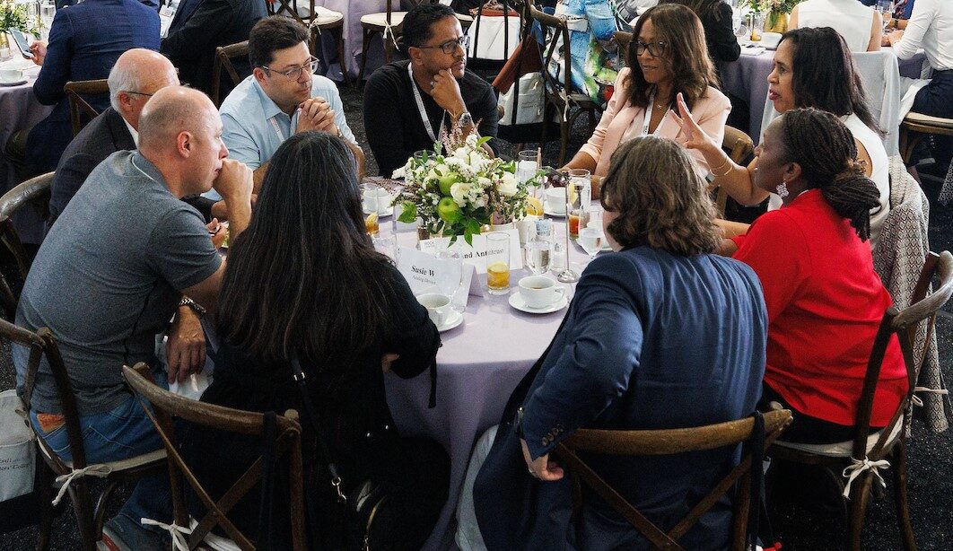 photo of executives sitting at a round table