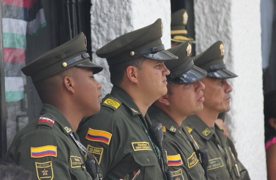 Colombian officers standing outside.