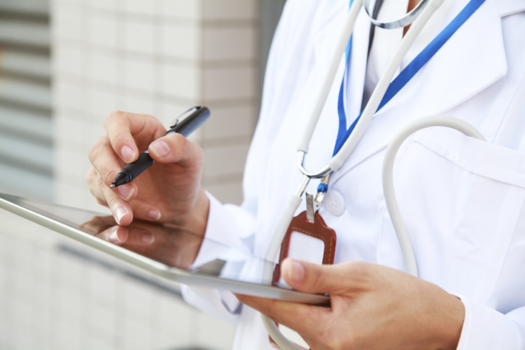 Doctor holding a clipboard and pen