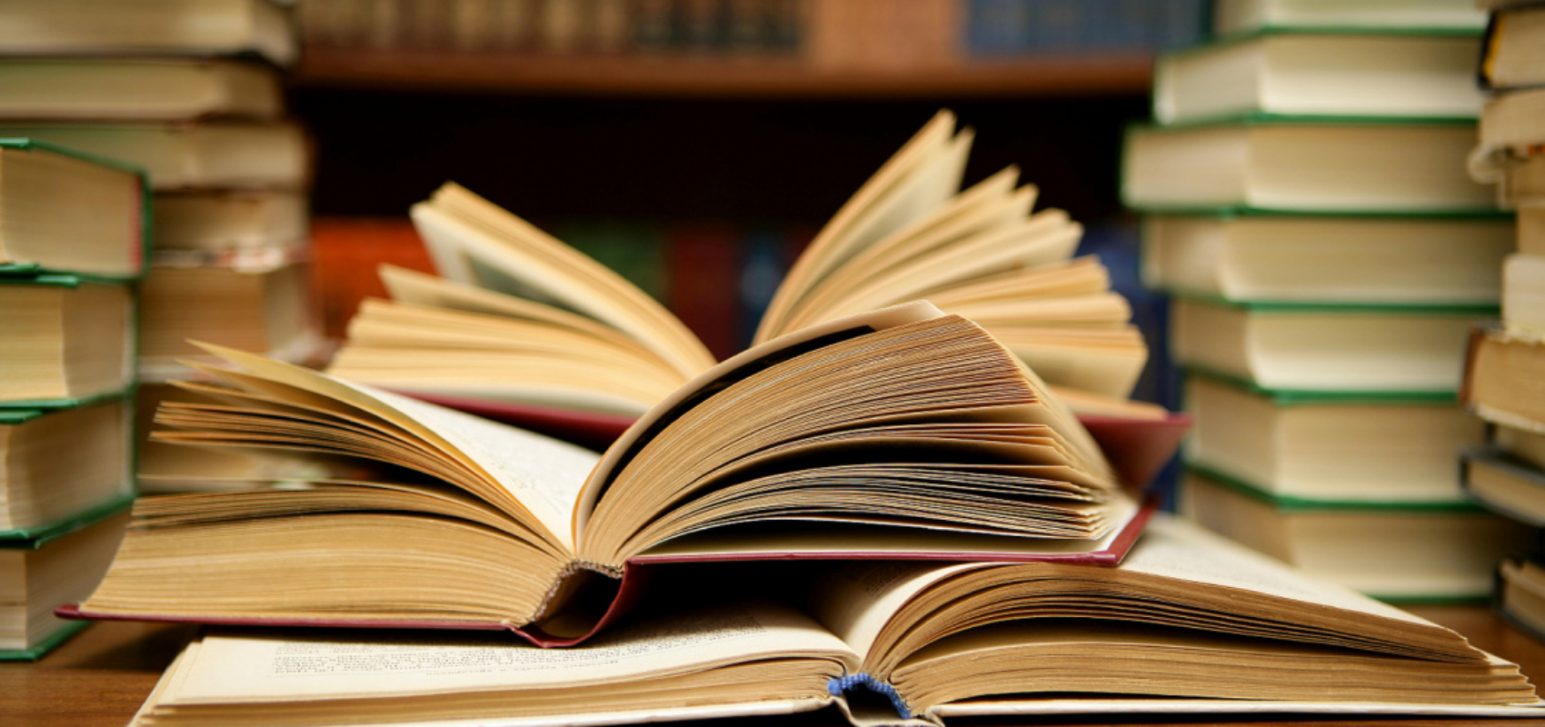 books on a table and on shelves