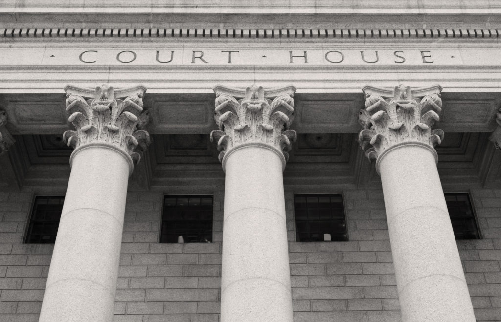 Close up of Courthouse building with pillars and columns.