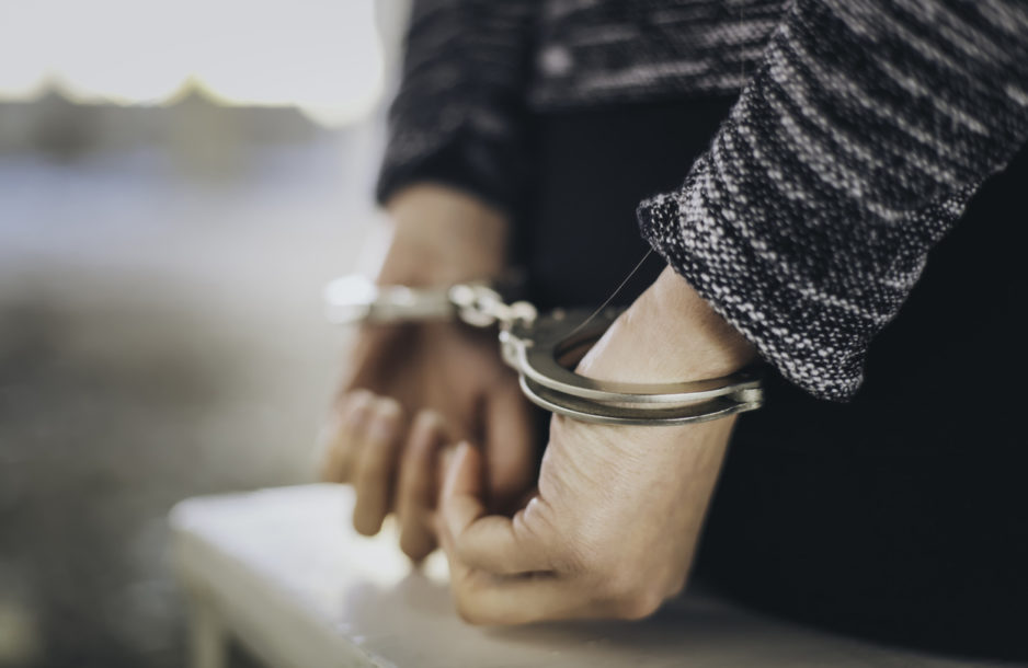 Woman's hands in handcuffs