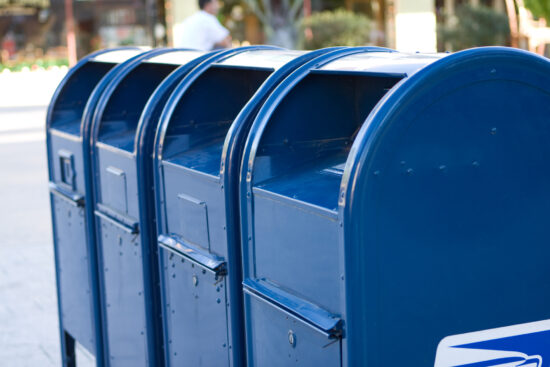 A row of blue mailboxes.