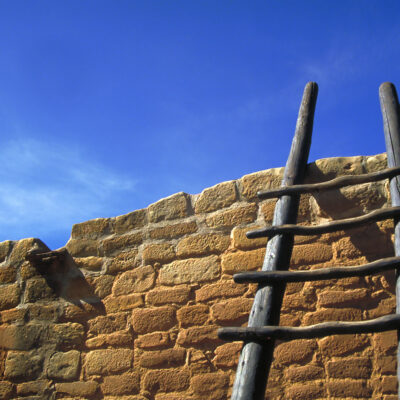 Hopi stairs agianst brick wall with blue sky