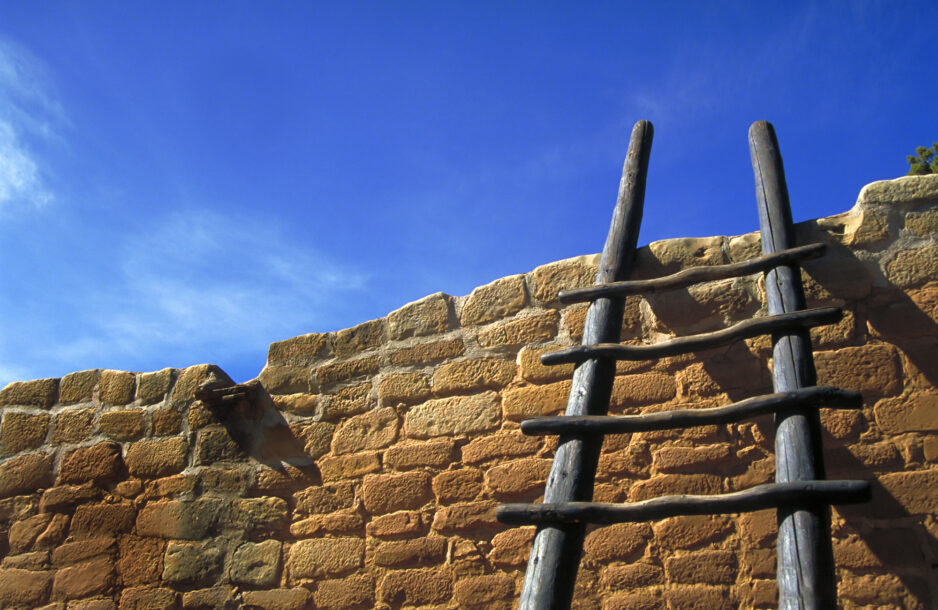 Hopi stairs agianst brick wall with blue sky