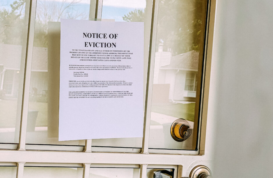 Eviction notice posted on the door of a home.