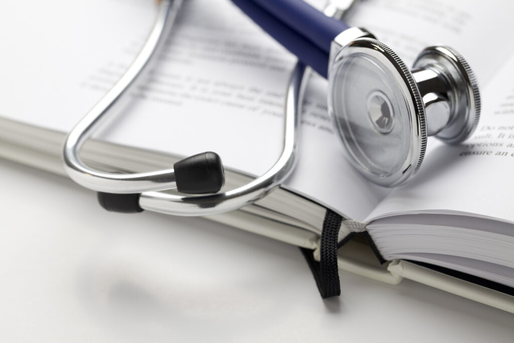 Stethoscope on book. All text was written by photographer and is copyright free.