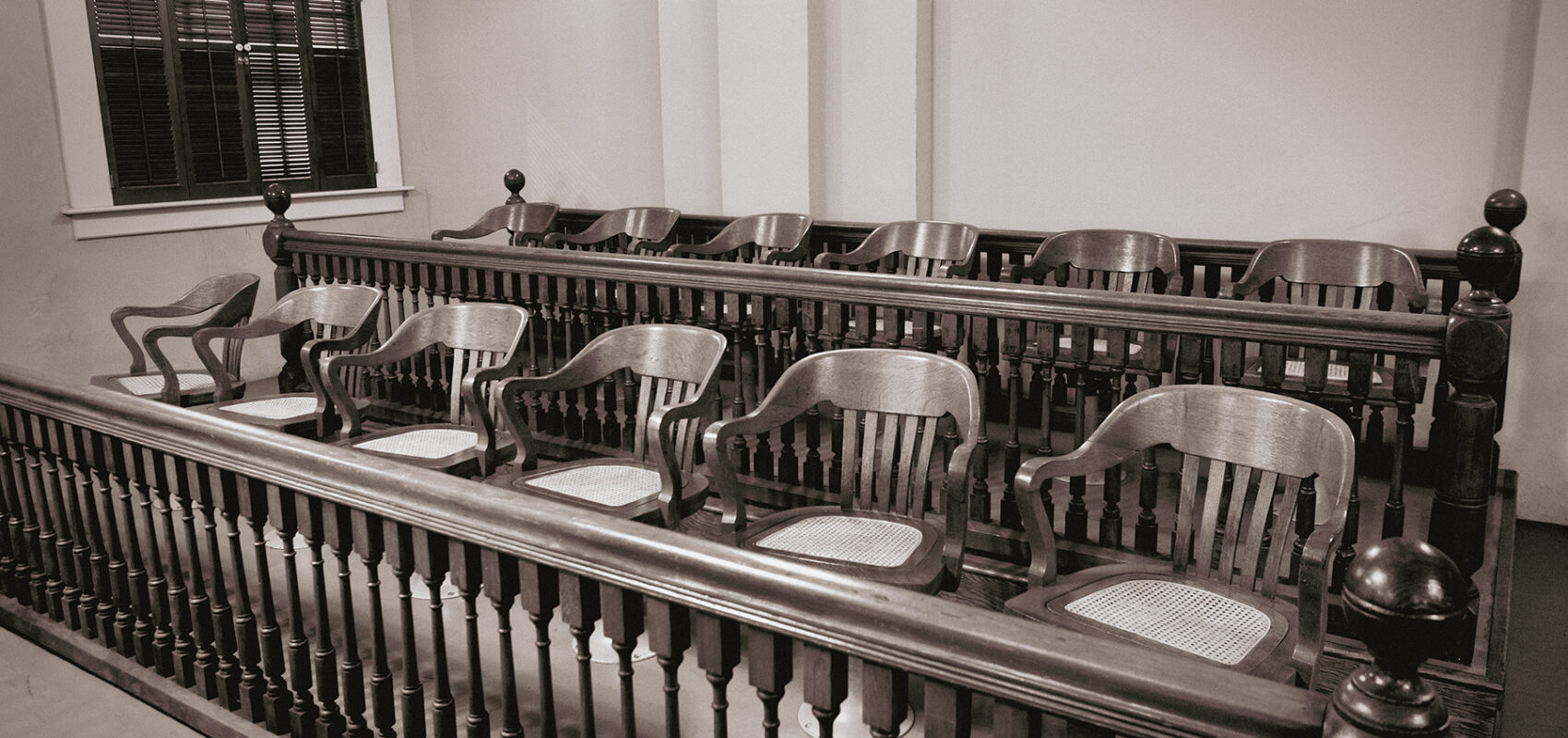 Photo of a jury section in a courtroom.