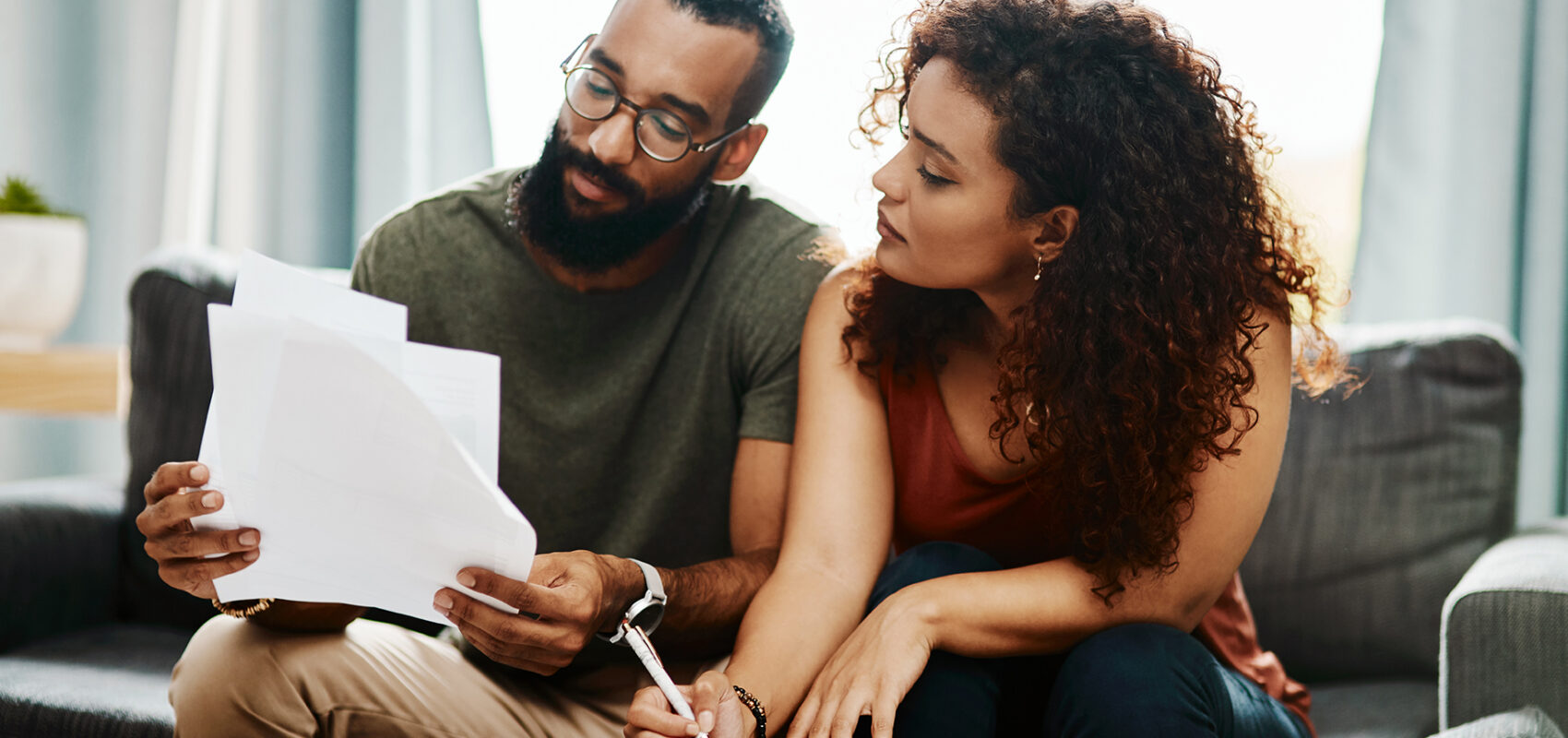 Photo of a couple looking at documents.